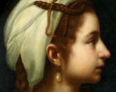 Cabeza femenina de perfil girada hacia la derecha